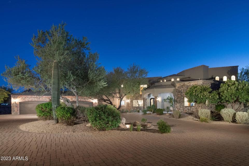 A circular drive and gated approach create a sense of arrival, setting the tone for a private estate experience from the moment you enter Merit Crossing.