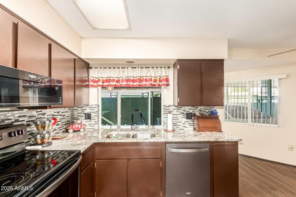 Beautiful updated kitchen with pass through to Arizona room - perfect for entertaining