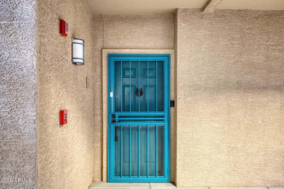 The front security door adds an extra layer of protection while allowing for airflow and natural light into the home. Designed for both safety and functionality, it enhances peace of mind without compromising curb appeal. A practical feature that supports comfortable living and secure entry access.