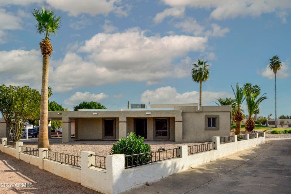 The main side of the home actually does not face the street, but rather a large yard bordered by the common area.
