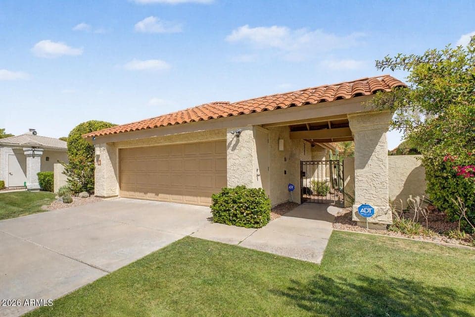 Beautifully maintained Scottsdale home with classic architecture, a two-car garage, lush landscaping, and a welcoming front entry. This move-in-ready residence offers exceptional curb appeal and a desirable lock-and-leave lifestyle.