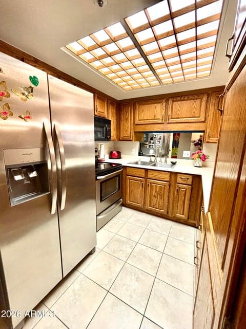 Newer appliances are already installed for you with well made oak cabinets