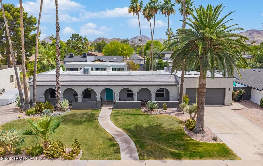 Front Aerial of home. Guest house roof visible in back.