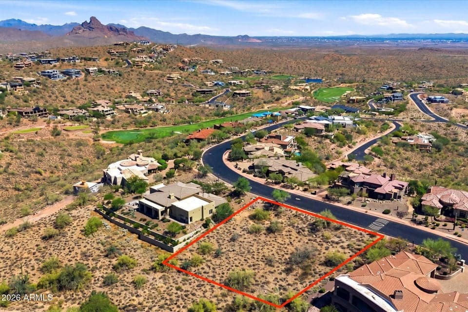 Premium Lot Location Highlighting the Upscale Neighborhood, Surrounding Golf Course, and Majestic Mountain Backdrop