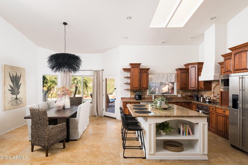 Large open kitchen, island seating and dining area