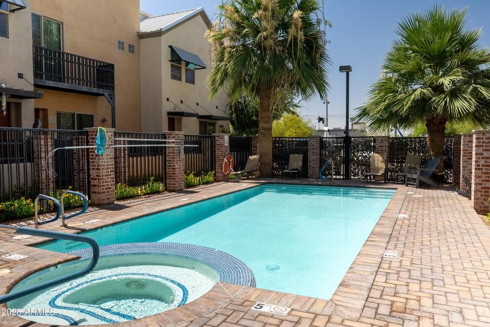 Enjoy a sparkling community pool surrounded by palm trees, lounge seating, and beautifully maintained grounds. This sought-after Mesa community offers a low-maintenance lifestyle with resort-inspired amenities perfect for relaxing or entertaining.