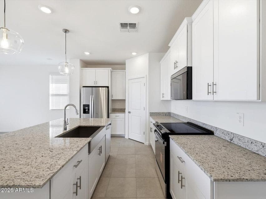 Photo is not of the actual home. Interior finishes and fixtures may vary.