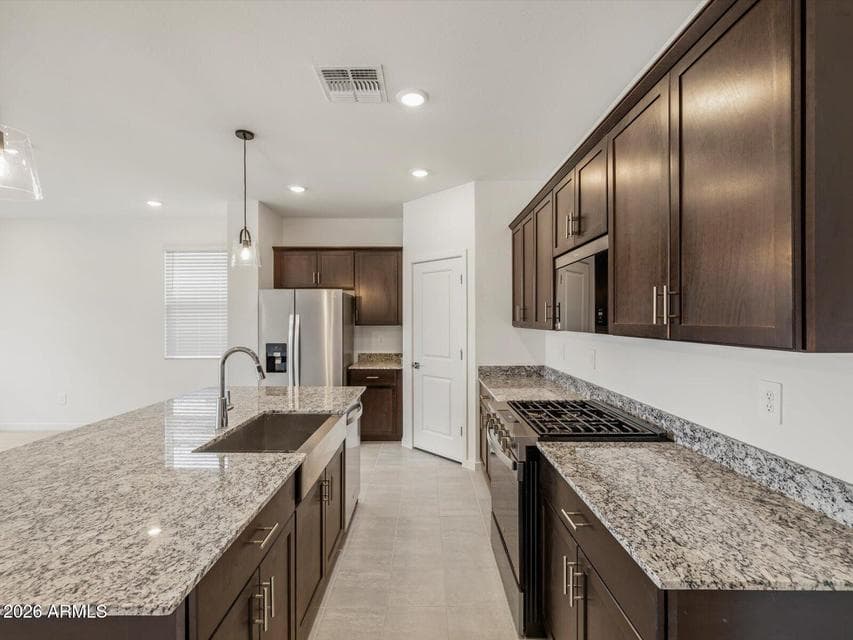 Photo is not of the actual home. Interior finishes and fixtures may vary.