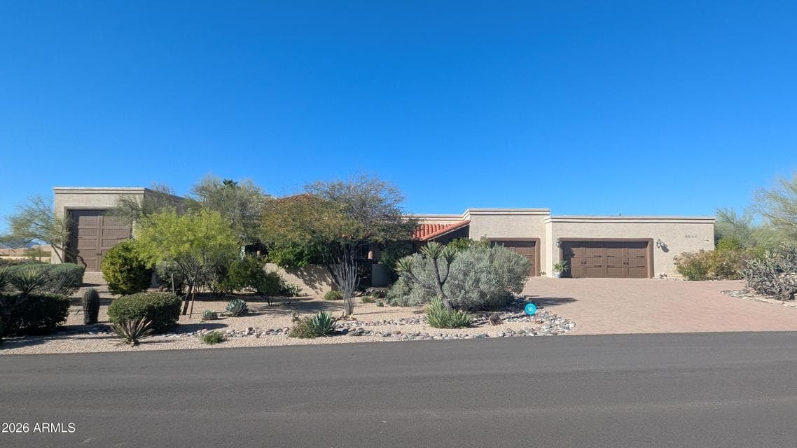 Situated on a quiet acre in Carefree with a casita, incredible garage spaces. Take time to explore all there is here!