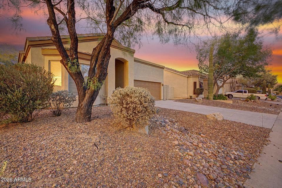Beautiful single-level exterior showcasing the welcoming front entry and spacious two-car garage.