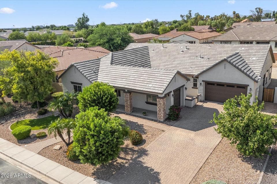 Concrete tile roof and lush, mature landscaping.