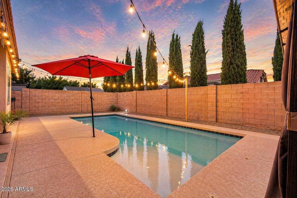 Spacious backyard with a refreshing pool and low-maintenance landscaping. Designed for relaxation and entertaining, offering the ultimate Arizona lifestyle in Casa Grande.