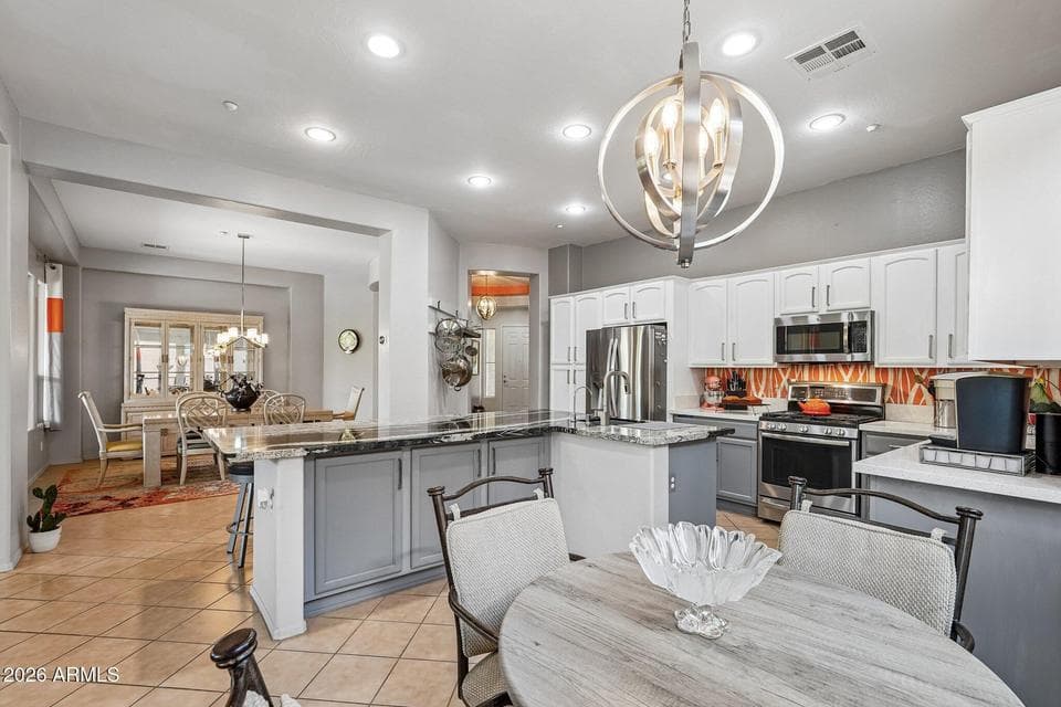 Fantastic Gourmet Chefs open kitchen w Huge Island w Granite Counter tops. Also Breakfast bar
