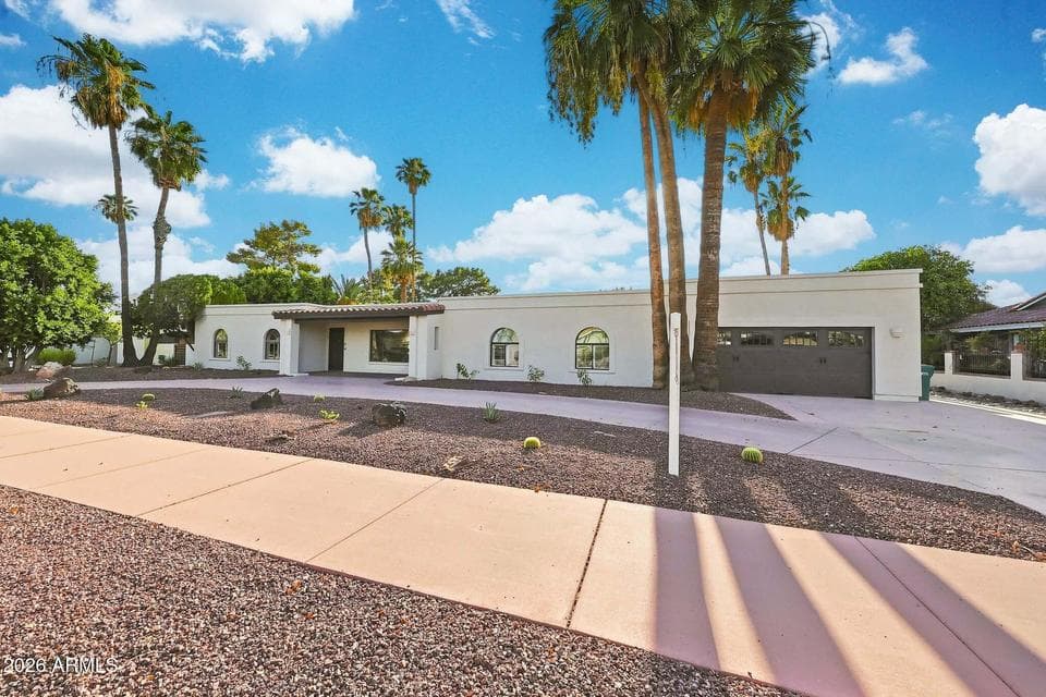 Fresh hardscape and new easy to maintain desert front landscaping.