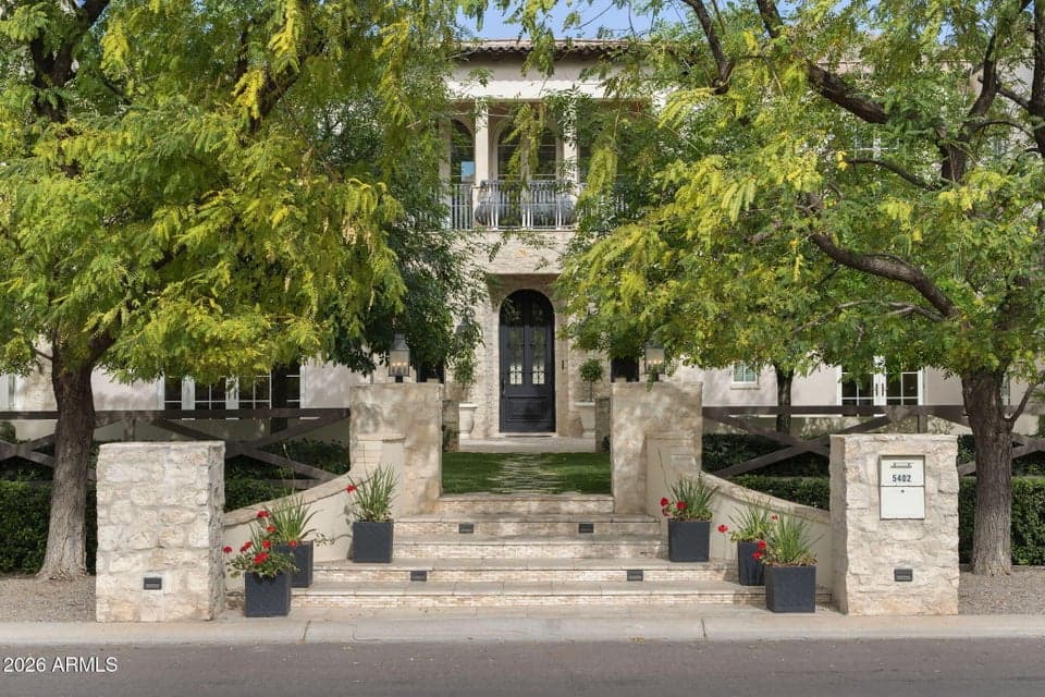 Situated on North/South corner lot with lush, mature trees for privacy