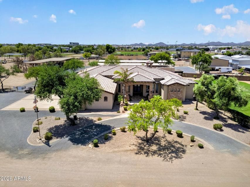 Custom home with barn and arena views