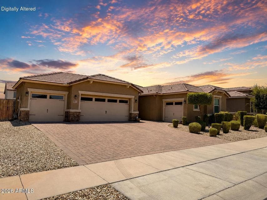 The front of the home with a 4 car garage.