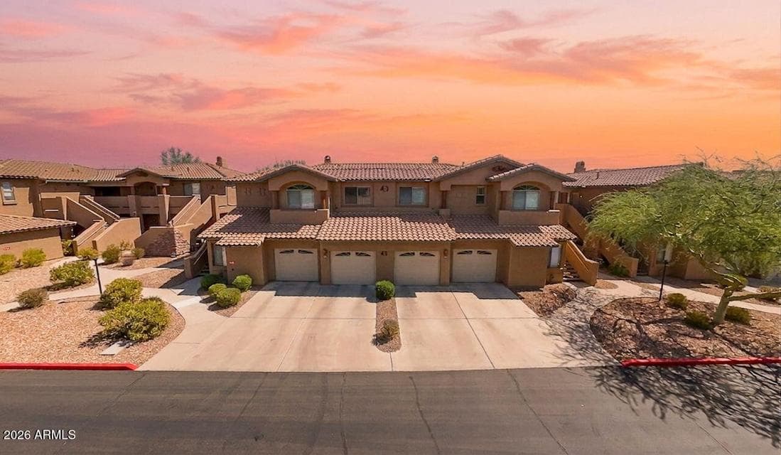 Second floor condo is tucked inside the gated community of Mirage Crossing near Scottsdale Mountain.