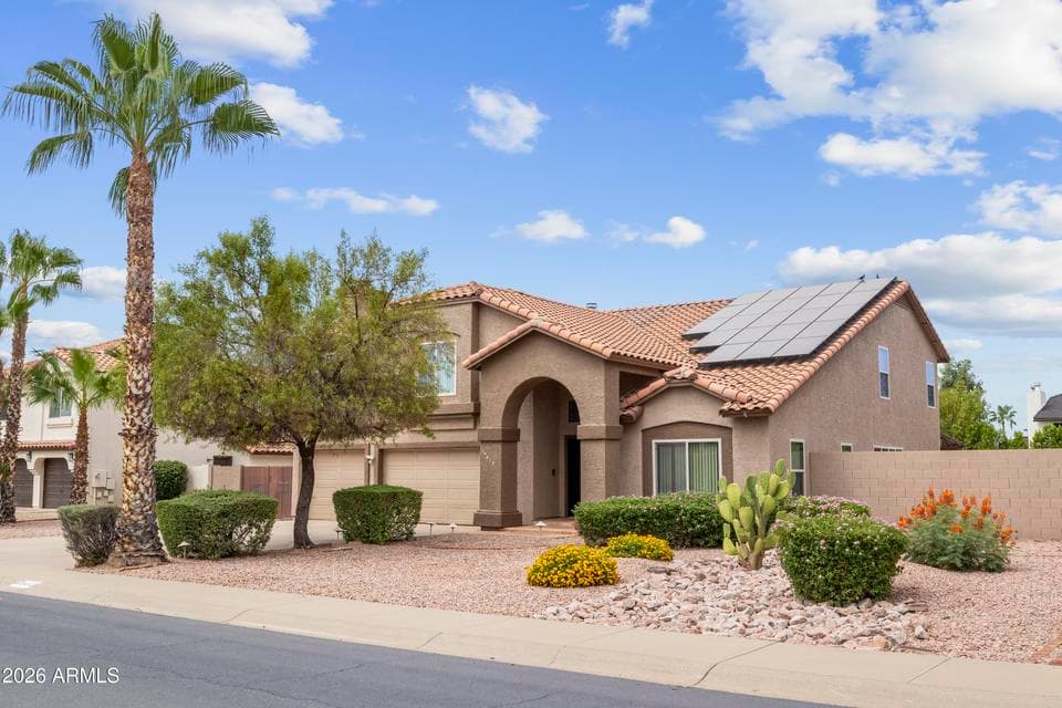 Front elevation featuring a spacious 3-car garage, attractive curb appeal, and a well-maintained exterior.