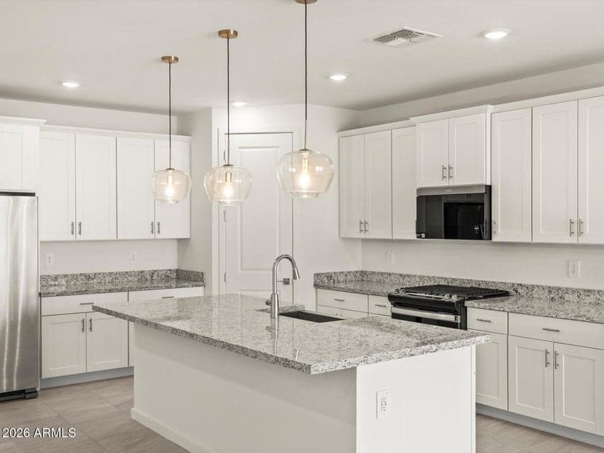 Photo is not of the actual home. Interior finishes and fixtures may vary.