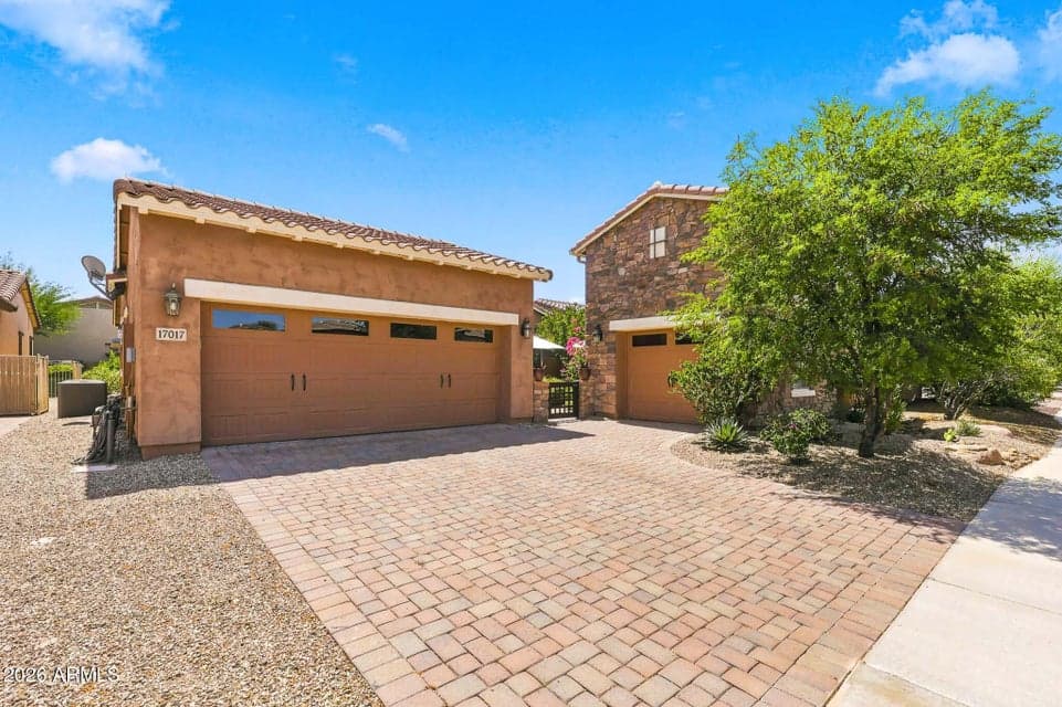Large Paver Driveway leading to both two-car and single-car garage