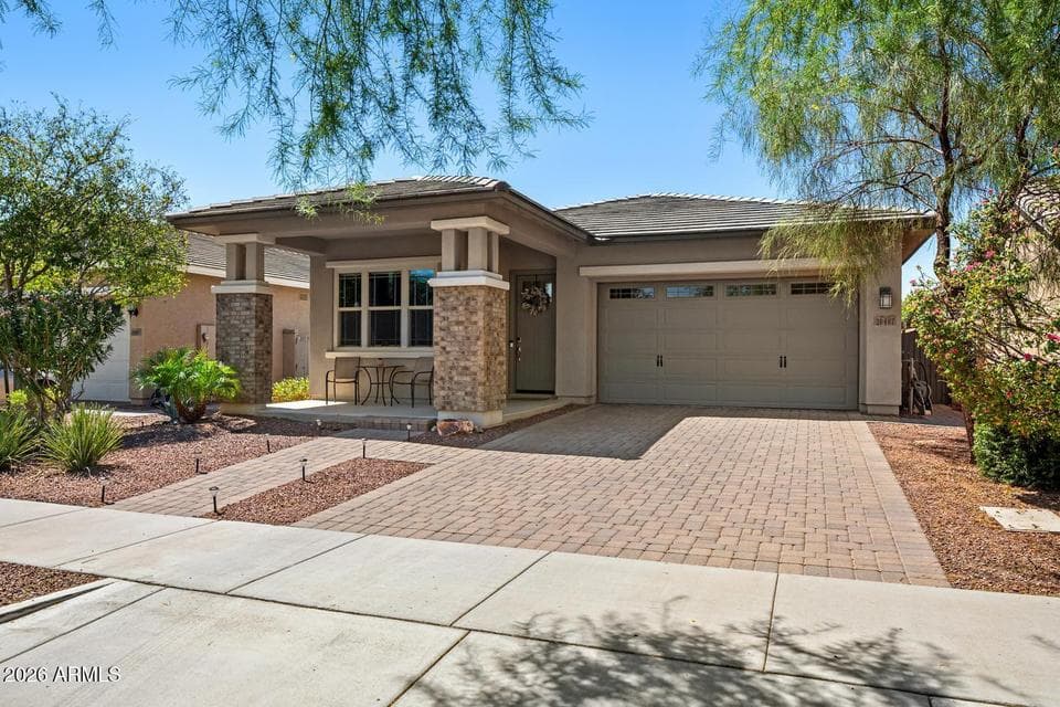 Paved driveway & sidewalk up to porch
