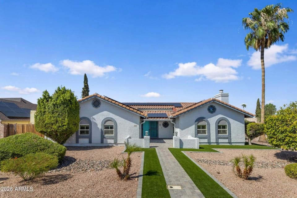 Beautiful North Mesa home with fresh exterior paint, low maintenance landscaping and artificial grass.