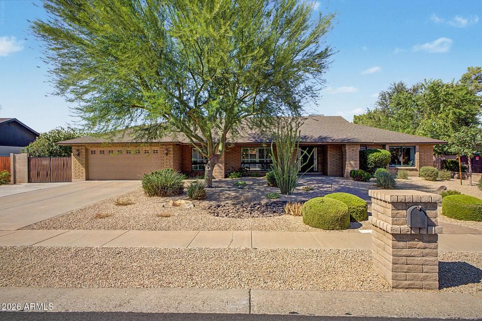 This beautiful semi-custom home features block construction, low-maintenance desert landscaping, and even your own private mailbox!