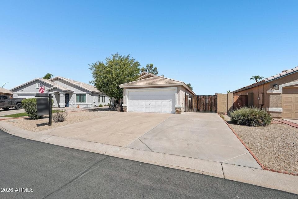 Extended width driveway - creating more parking opportunities with a double RV gate between the front & back of the house