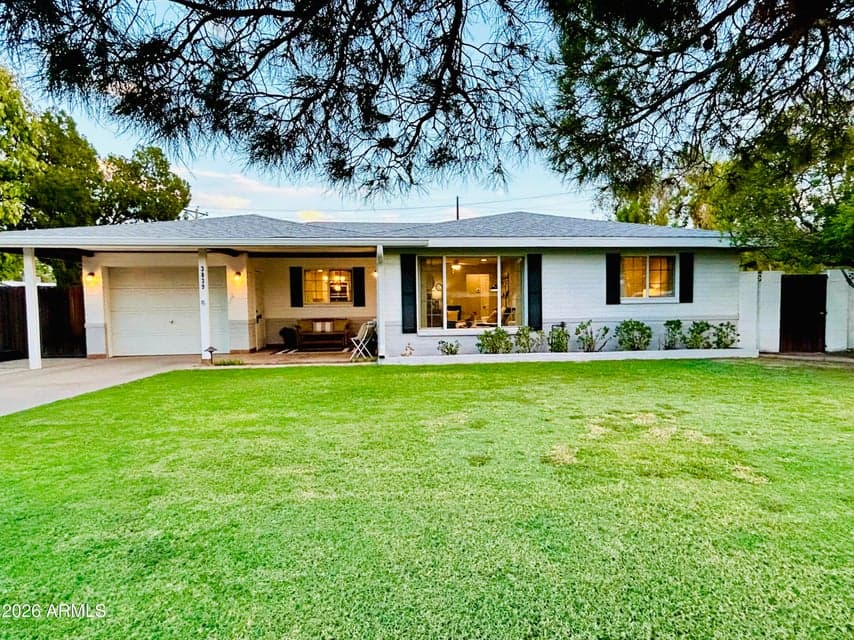 Beautiful Curb Appeal with white paint and black shutters, & a Cozy Front Porch overlooking the large grassy Front Yard & Mature Trees.