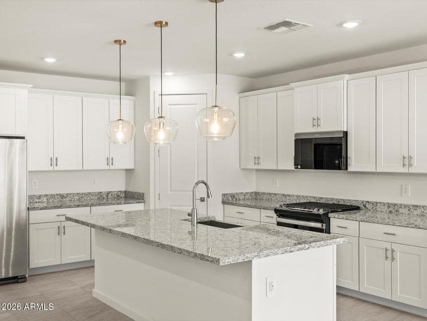 Photo is not of the actual home. Interior finishes and fixtures may vary.