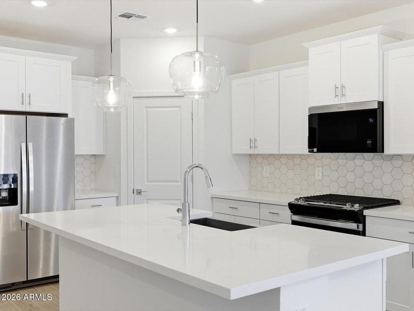 Photo is not of the actual home. Interior finishes and fixtures may vary.