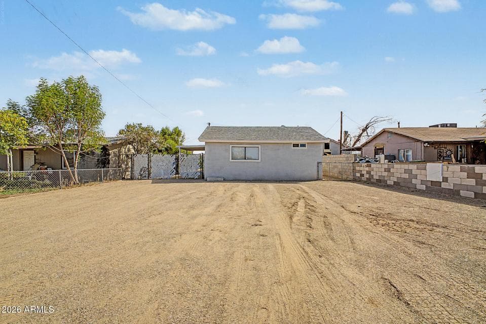 Front of the home with lots of parking and endless possibilities