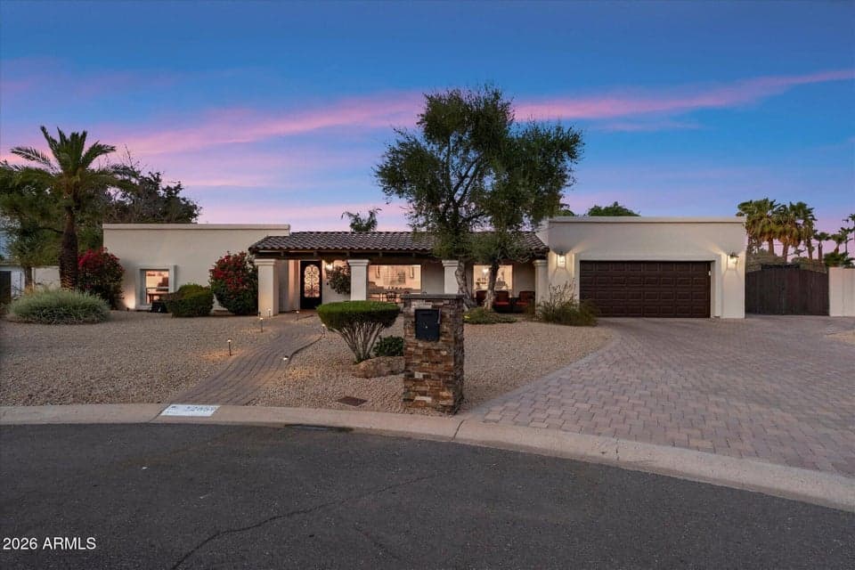 Smooth Stucco, Paver Driveway and Walkway, RV Gate, and Timed Landscape Lighting