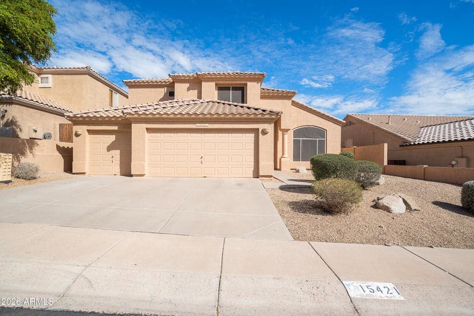 15421 S. 16th Dr. Welcome to this large home with a rare three car garage and easy low maintenance desert landscaping