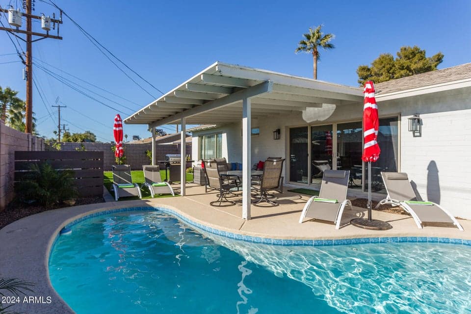 Private backyard with recently resurfaced private pool with brand new pool lights.