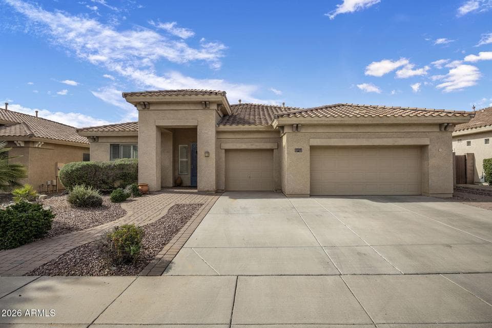 Spacious driveway and front exterior showcasing clean lines and excellent curb appeal