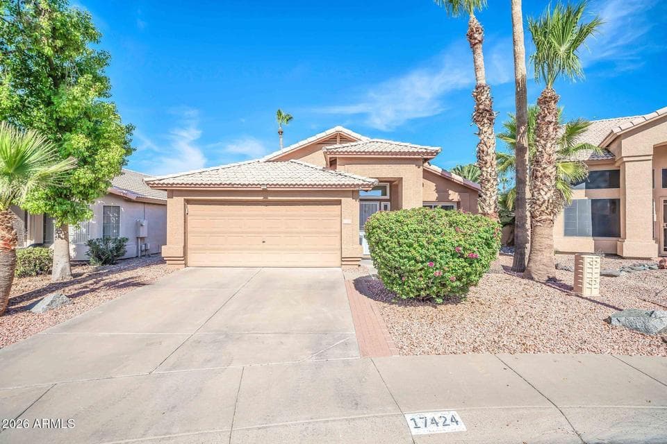 Welcome home to this attractive single-level Phoenix residence showcasing mature palm trees, desert landscaping, a two-car garage, and excellent curb appeal. The inviting exterior highlights low-maintenance landscaping and a move-in-ready home in a desirable location close to shopping, dining, parks, and freeway access.