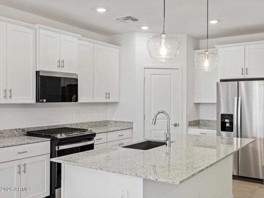 Photo is not of the actual home. Interior finishes and fixtures may vary.