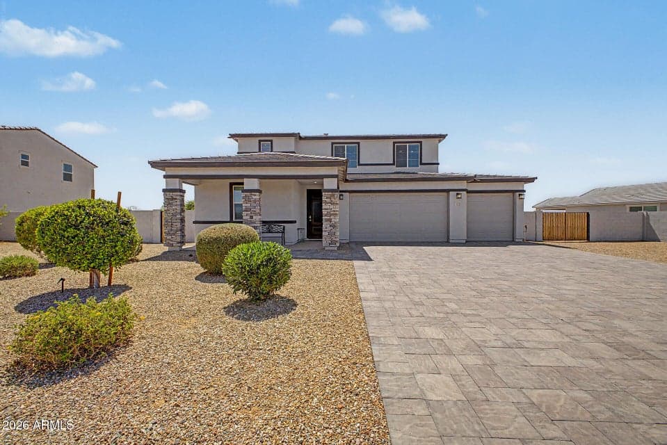Gorgeous property with upgraded elevation including large paver driveway & RV Gate.