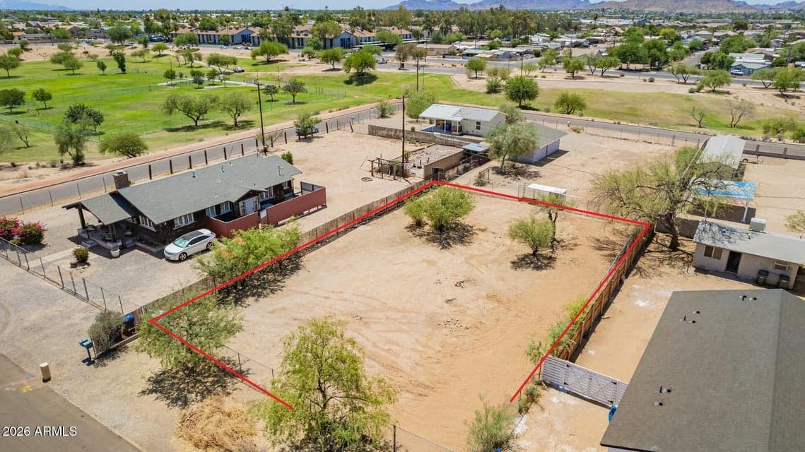 Aerial showing the lot with the city park to the east