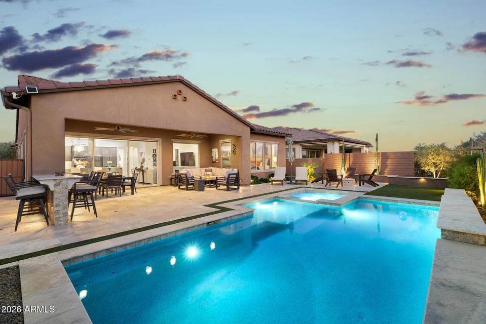 Stunning Backyard Retreat designed by AZ Rainfall. Complete Outdoor Kitchen, Heated/Cooled Pool, Firepit,, 12' Sliding Door, multiple seating areas.