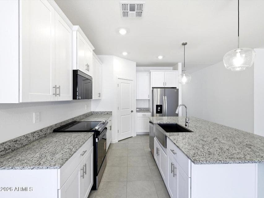 Photo is not of the actual home. Interior finishes and fixtures may vary.