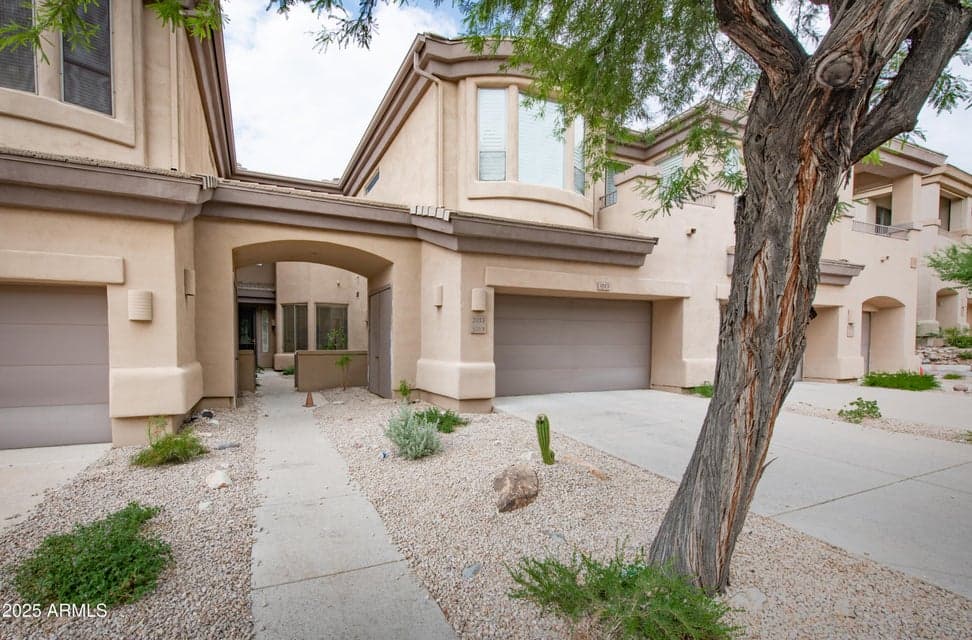 Front of the condo. The 2 car garage is shown on the right. The community does not allow overnight drive-way parking for units with 2 car garages.
