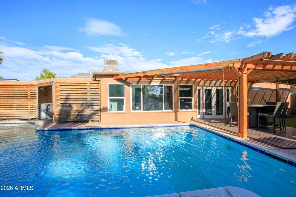 Great view of back of home across pool