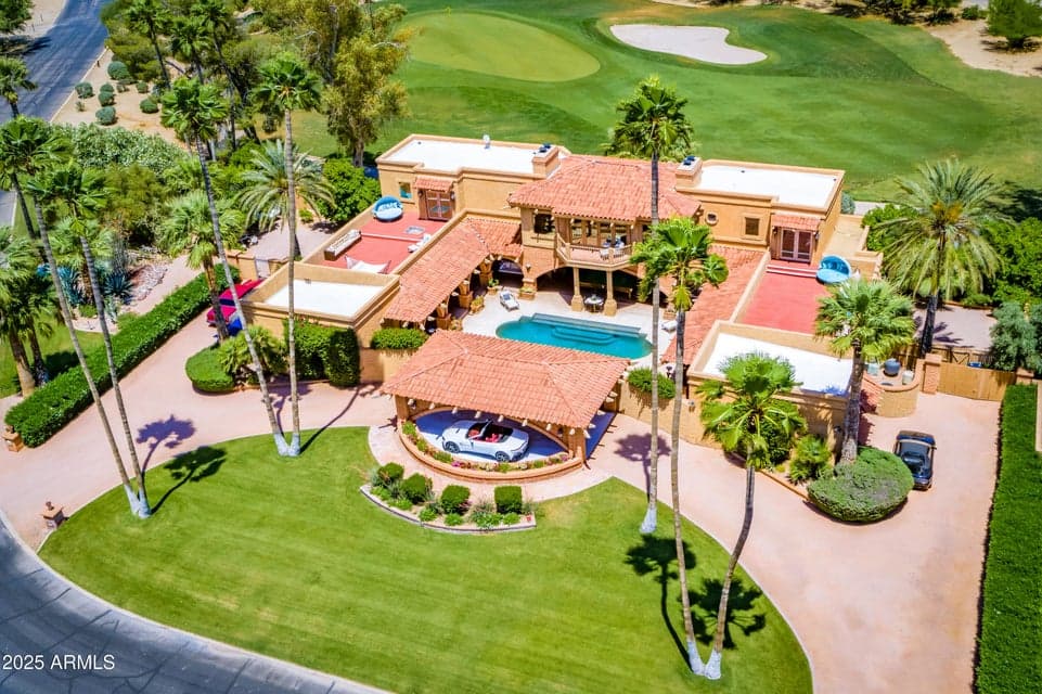 View of the entire estate including the corner golf green, circular driveway, twin garages, twin rooftop decks, interior courtyard with private enclosed walk-in Roman heated pool, jacuzzi, outdoor shower and snooker lounge.
