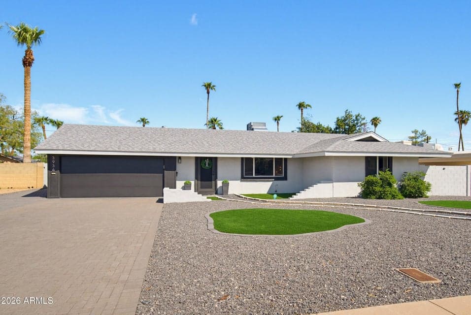 Low-maintenance turf, fresh exterior paint and an expansive brick-paver driveway.