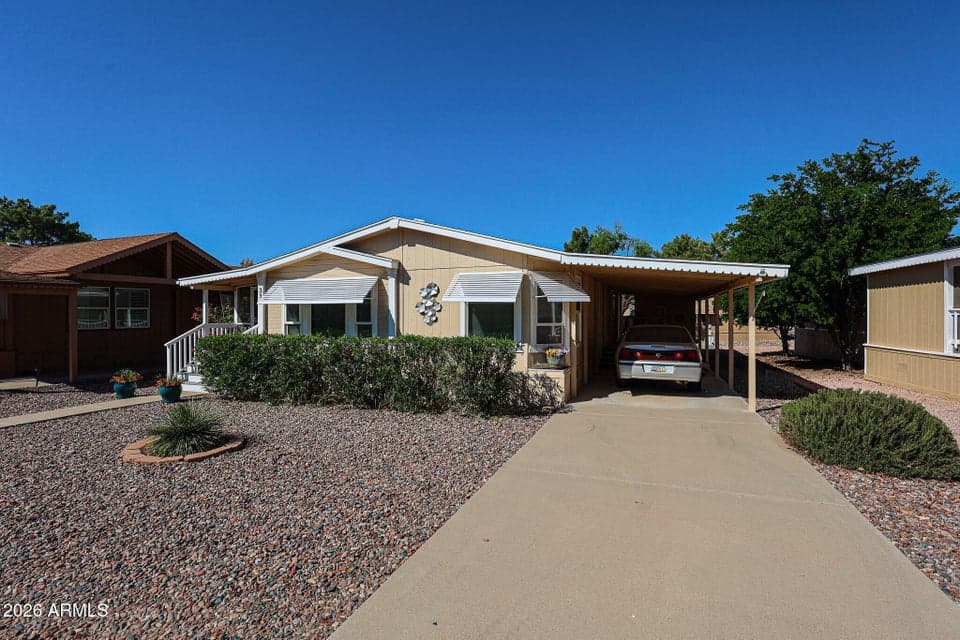 Nice sized front yard. Covered parking plus extra slab parking